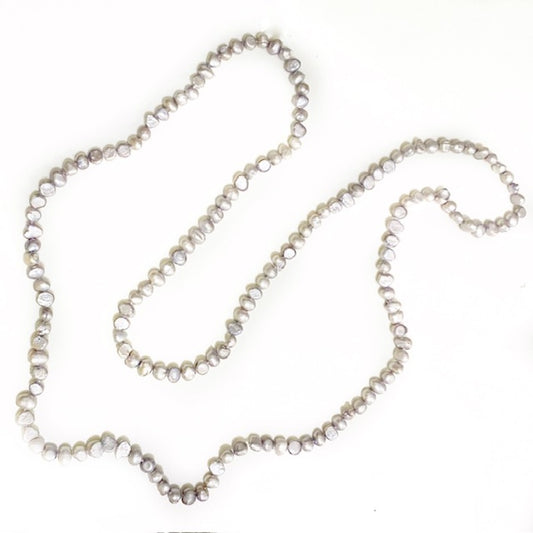 Top view of the threaded, not knotted long 42-inch continuous strand grey pearl necklace