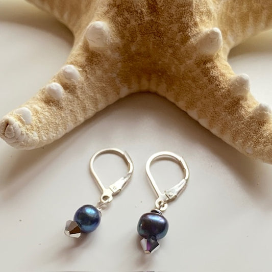 Sterling silver lever-back classic navy pearl and crystal earrings shown with starfish prop