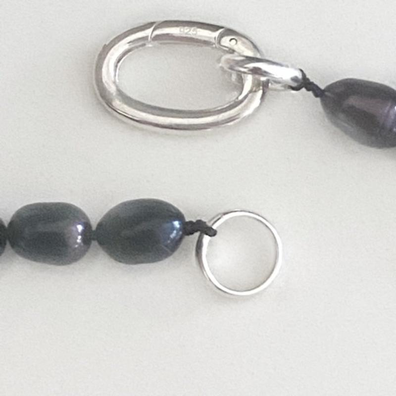 Closeup of the Sterling link clasp joining the pearl strand 