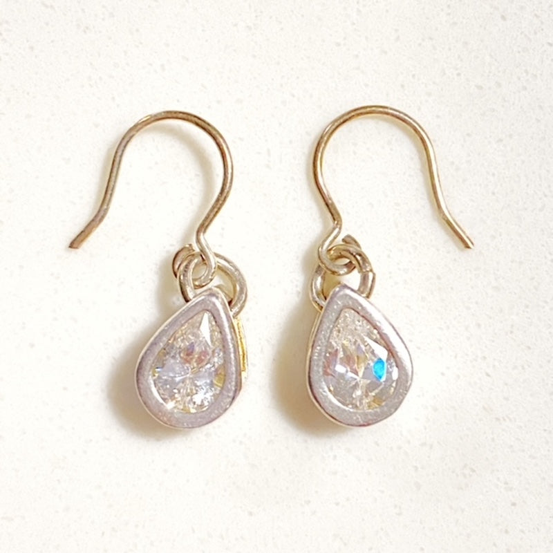 Top view of the pair of cubic zirconia sterling silver fish-hook earrings included in this bundled set