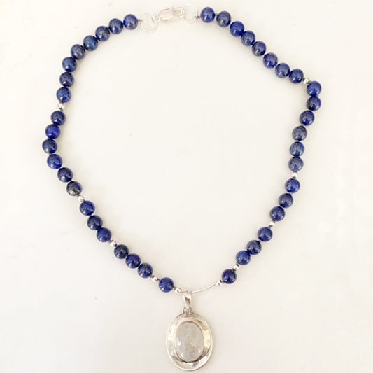 Top view hand-knotted Lapis Lazuli round beads with oval Moonstone sterling silver kinetic motion pendant