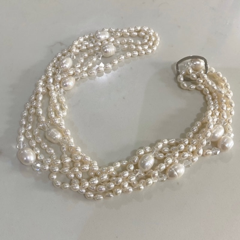 Super long knotted 96-inch pearl necklace triple draped as choker with silver-tone link clasp