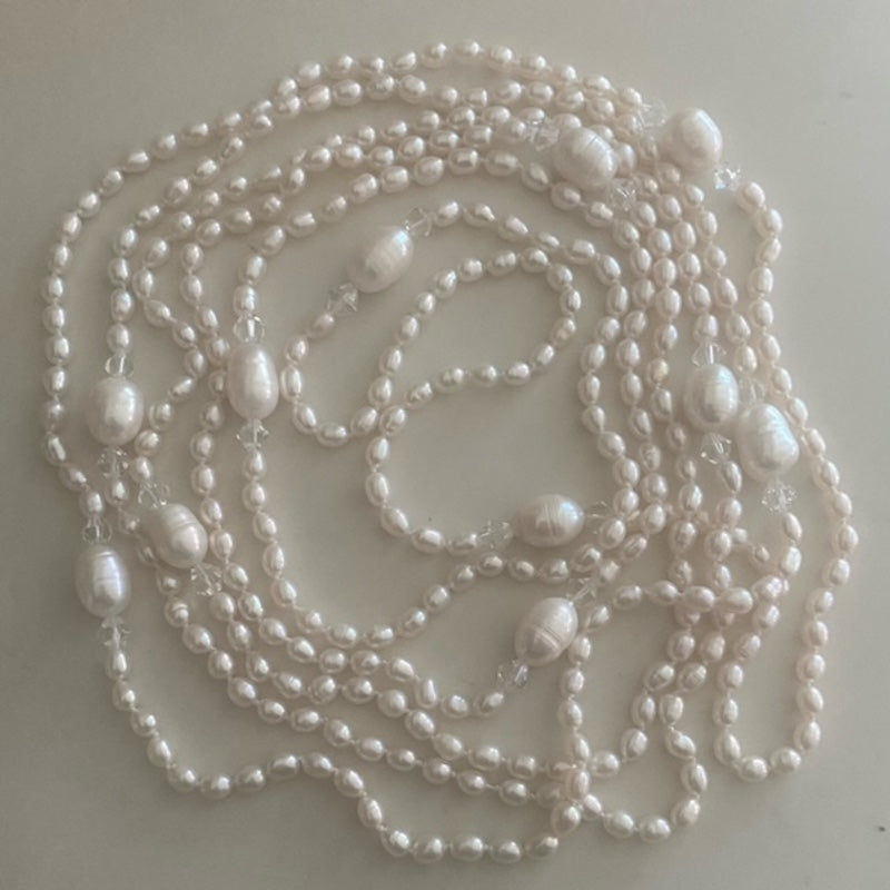 Top view of the super long 96-inch knotted pearl necklace with crystal accents