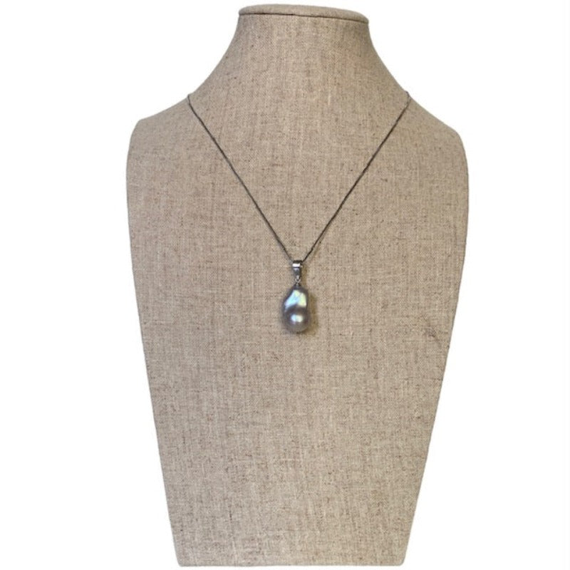 Large Pink Baroque Pearl on 18 inch fine sterling silver chain shown on linen jewelry bust