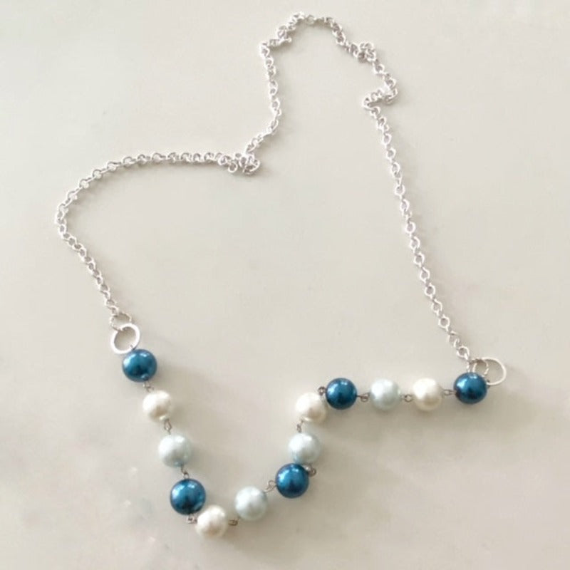 Wire-wrapped 30-inch necklace with light and dark blue faux shell pearls and creamy white shell pearls with silver-plated chain