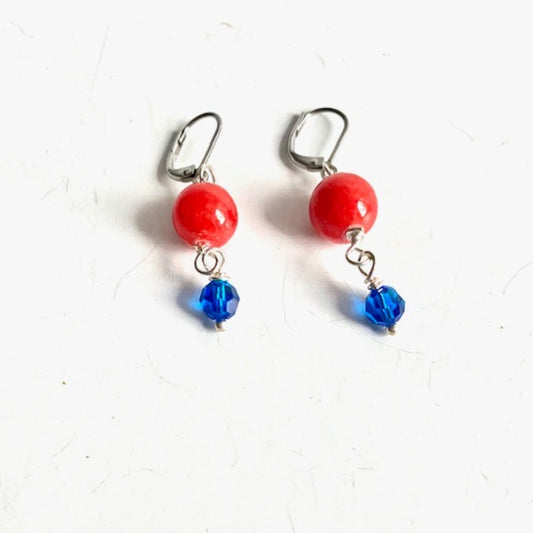 Round Orange Carnelian Dangling Earrings with Blue Crystal Accents top view 