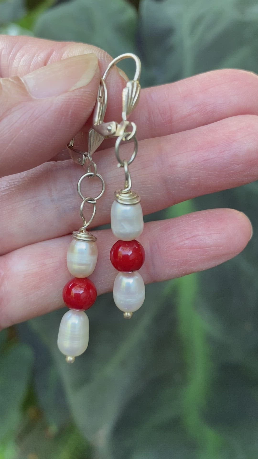 Video of white pearl and red lacquer bead dangling 1 1/4" long earrings on silver-plated leverbacks