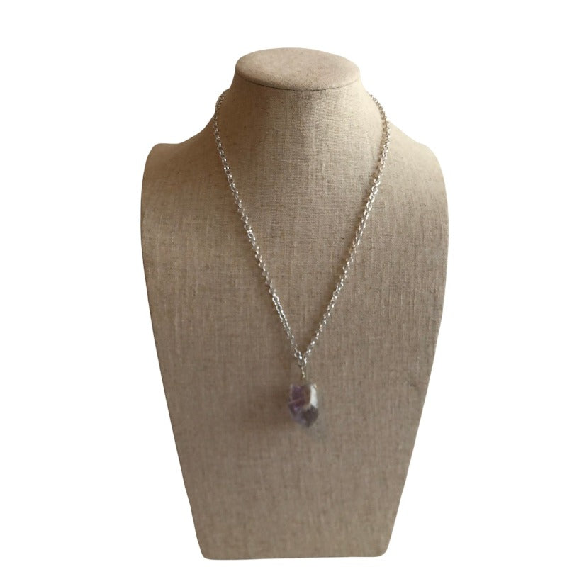 Amethyst raw facetted 1 inch organic pendant shown full view on linen bust