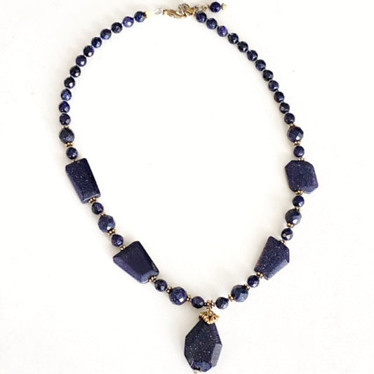 Beaded 16 inch blue goldstone necklace with extender chain top view