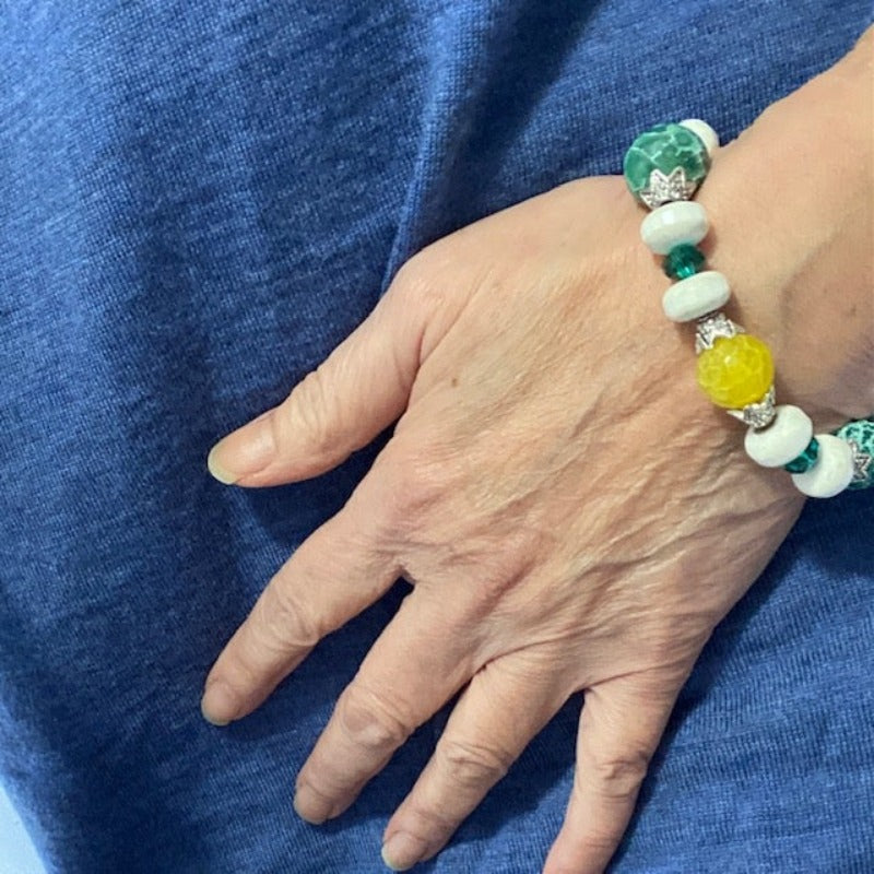 Beaded green yellow white agate bracelet worn by model