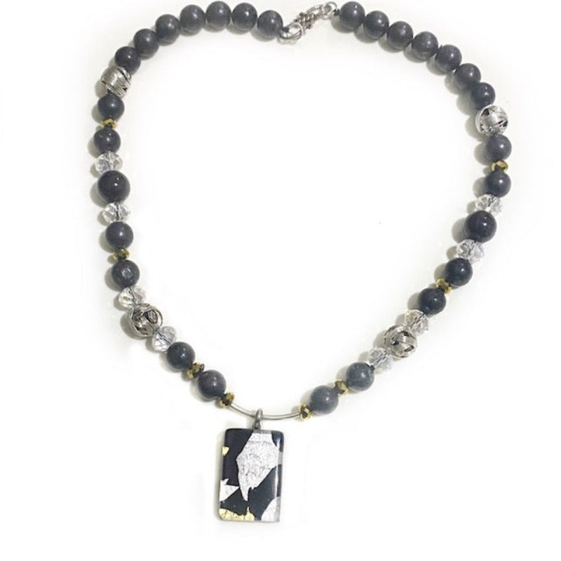 Alternate top view of the 18-inch hand-knotted black-silver-gold dichroic glass pendant suspended from the granite,onyx,crystal necklace