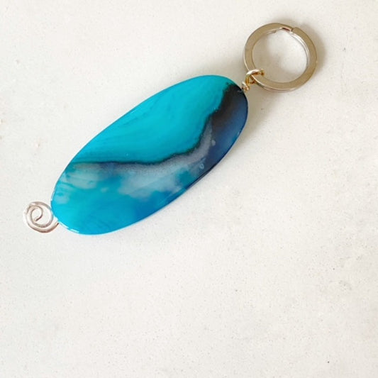 Polished oval blue agate semiprecious keychain top view