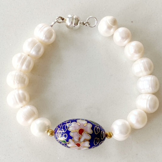 White freshwater pearl  knotted 8" bracelet with large 1" oval blue cloisonne centre accent bead Top view