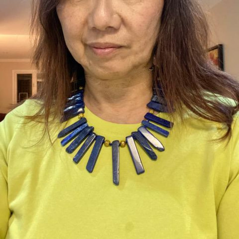 Chunky hand-knotted blue lapis lazuli flat spike 19 Inch necklace on model