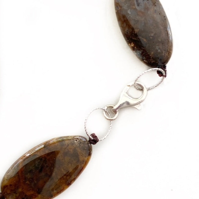 Closeup of brown jasper beads with sterling silver secure lobster clasp closure
