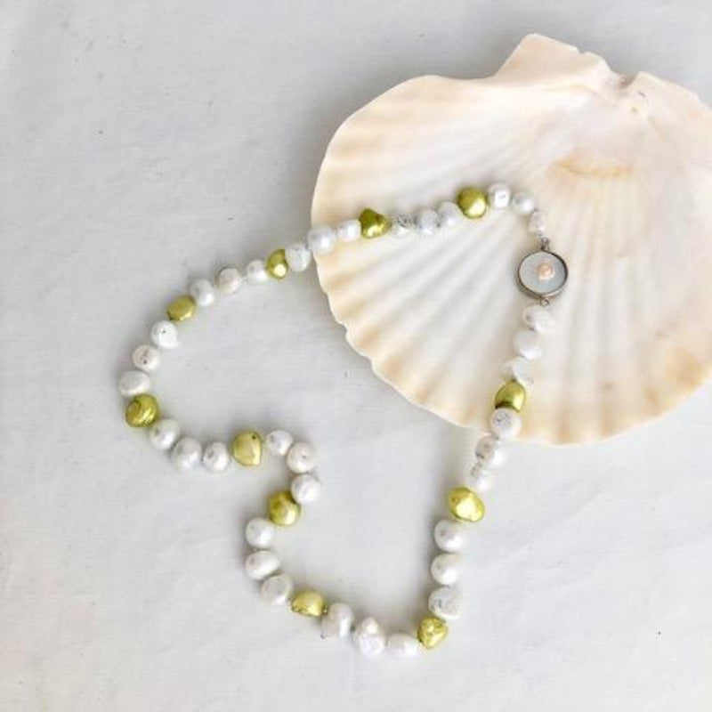 Single Strand Chartreuse and Pale Silver Hand-knotted Pearl Necklace with Pearl Box Clasp shown on Shell display