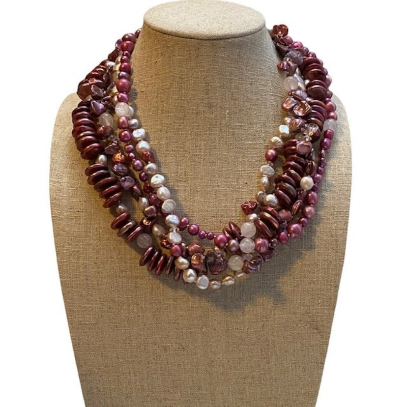 Chunky statement 4-strand knotted pink fuchsia rose pearl necklace shown on linen bust
