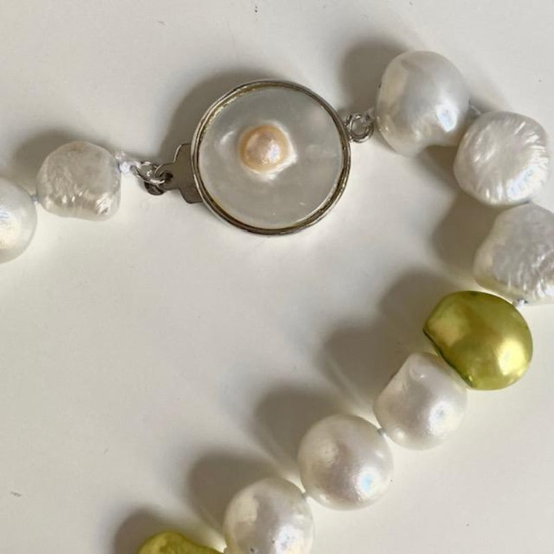 Closeup of the Mother-of-pearl box clasp on the chartreuse and silver pearl necklace
