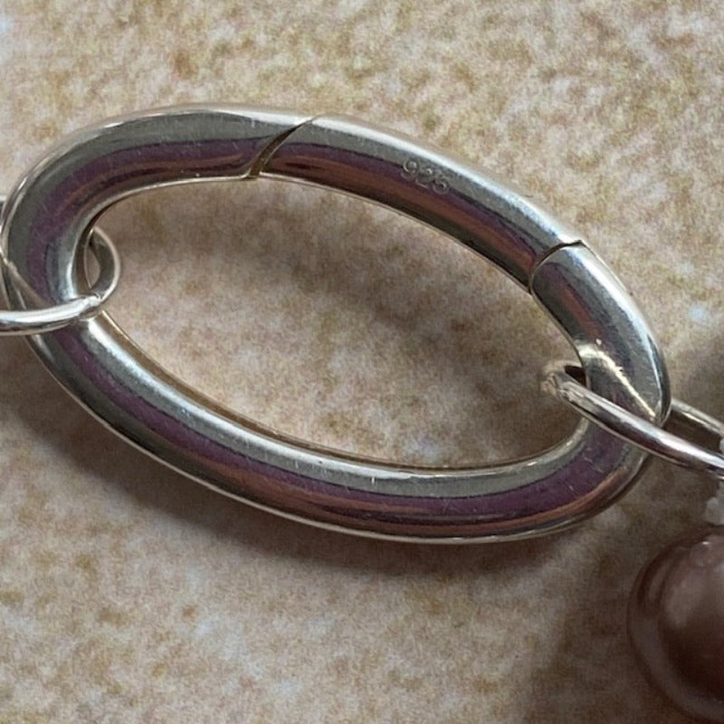 Closeup of the sterling silver oval removable link clasp