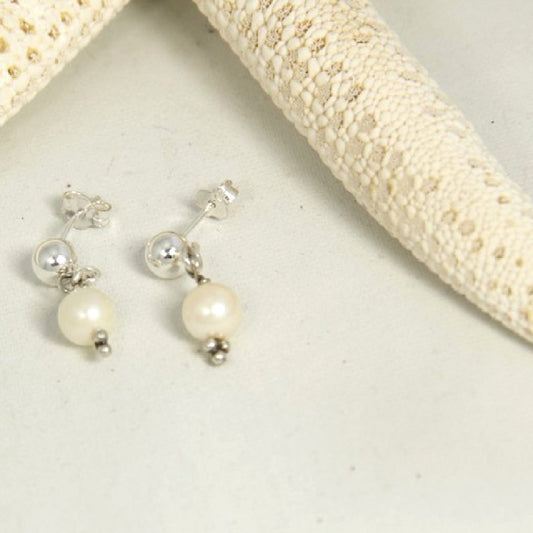 Classic Pearl Drop Ball Stud Earrings near Starfish Prop