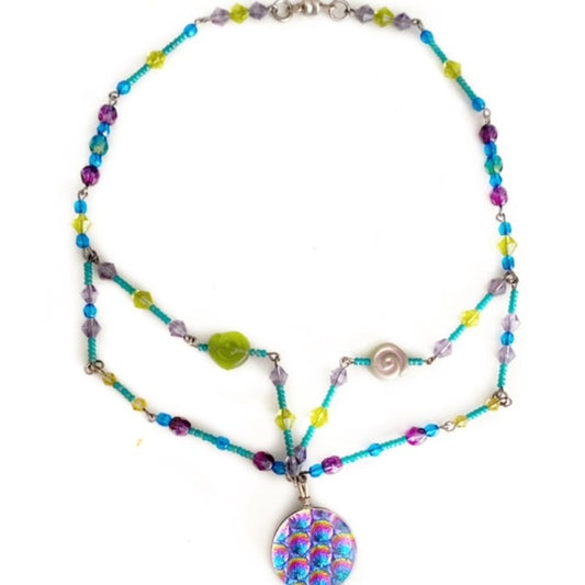 1960's Vibes round dichroic glass beaded 17-inch wire necklace with magnetic clasp top view