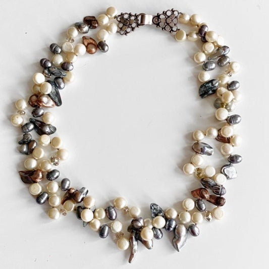 Double strand knotted yellow, brown, silvery-blue 21 1/2 inch pearl necklace with fancy sterling hook clasp top view