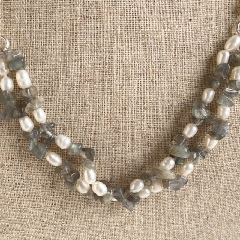 Closeup of the double strand segments of the hand-knotted white pearls and  gray Labradorite chip beads