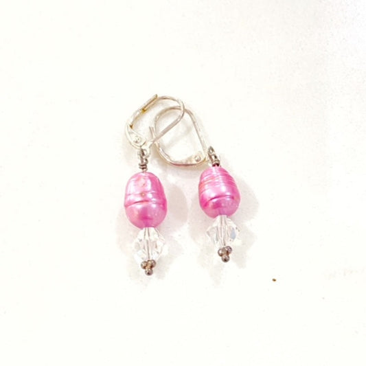 Dyed bright pink freshwater pearl and Austrian white crystal drop earrings on silver-tone lever-back ear-wires top view