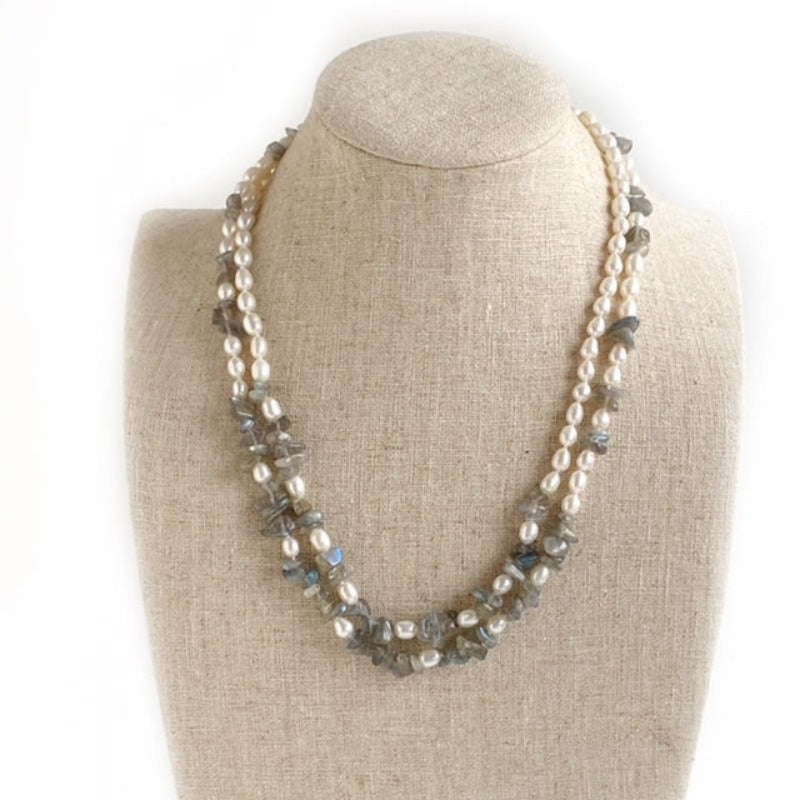 Full double strand hand-knotted white pearls and gray Labradorite chip bead 18-1/2 inch necklace with silver lobster clasp shown on linen jewelry bust