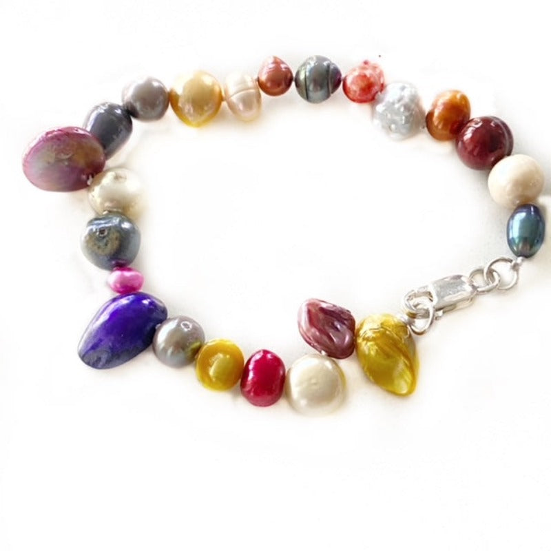 Alternate full view of the hand-knotted 7-3/4-inch dyed multi-coloured pearl bracelet with vertical cranberry centre pearl and sterling clasp