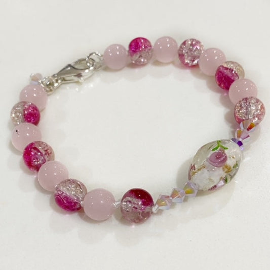 Knotted Rose Quartz, pink glitter beads, crystal, gval glass bead 7 1/4-inch bracelet top view