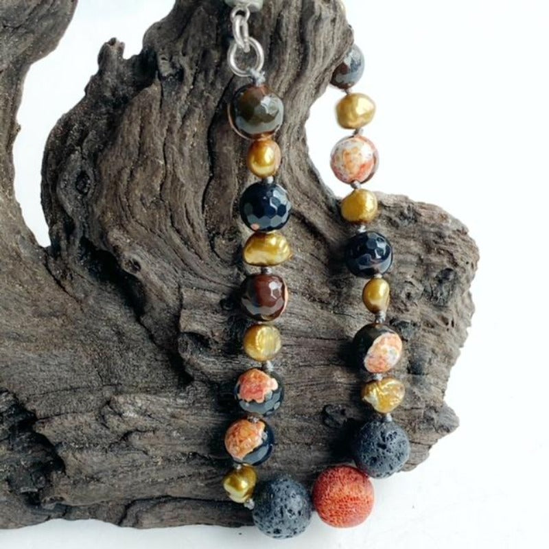 Koi-inspired Orange/Black Agate Pearl Lava Rock Essential Oil Bracelet on Driftwood Display