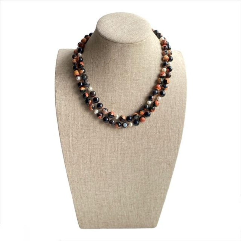 Koi Long Hand-knotted Single Strand Orange Agate White Pearl Necklace shown doubled on Linen Bust