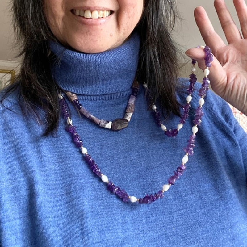 Long knotted 36-inch amethyst and pearl necklace shown styled with another shorter Amethyst necklace to show layered styling suggestion