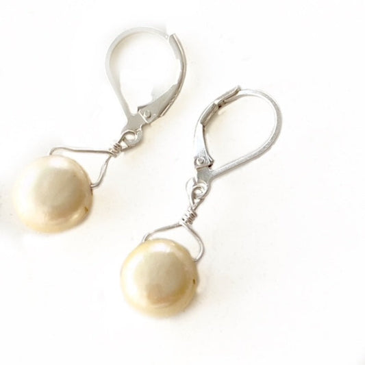 Pale yellow freshwater pearl wire-wrapped single drop earrings on Sterling silver lever-back ear wires Top view