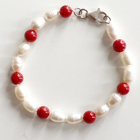 Red lacquer bead and white pearl 7 3/4" hand-knotted bracelet top view