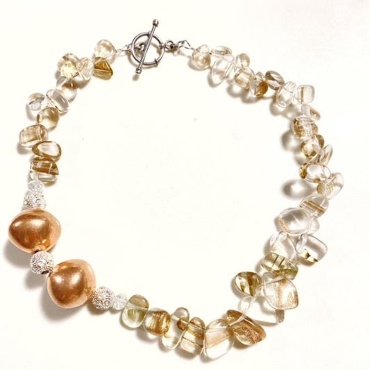 Beaded Rutilated quartz beads, sparkling crystals accents and two large rose gold beads in a chunky asymmetrical choker style necklace Top view