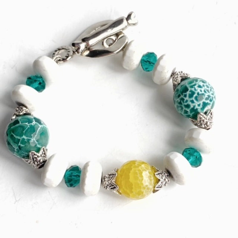 Beaded single strand green yellow white agate bracelet shiny silver-plated heart/bar toggle clasp top view