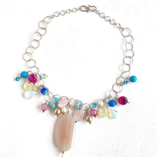 Semiprecious wire-wrapped 18-inch dangle bead pink agate pendant Sterling chain necklace Top view