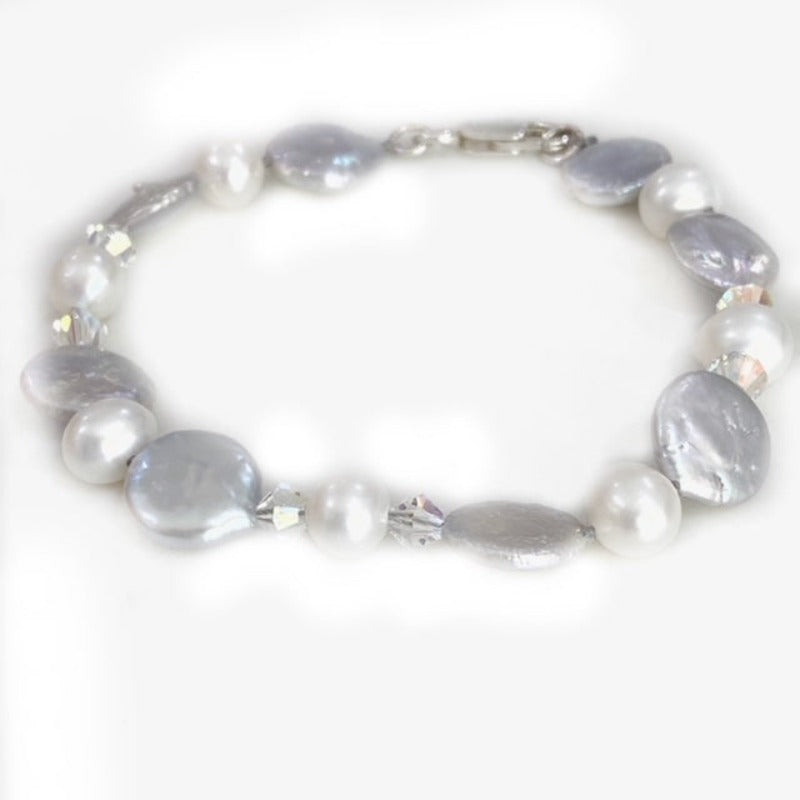 Front view of silver-gray coin pearl and white side-drilled pearls with crystal accents in the 8-inch knotted bracelet