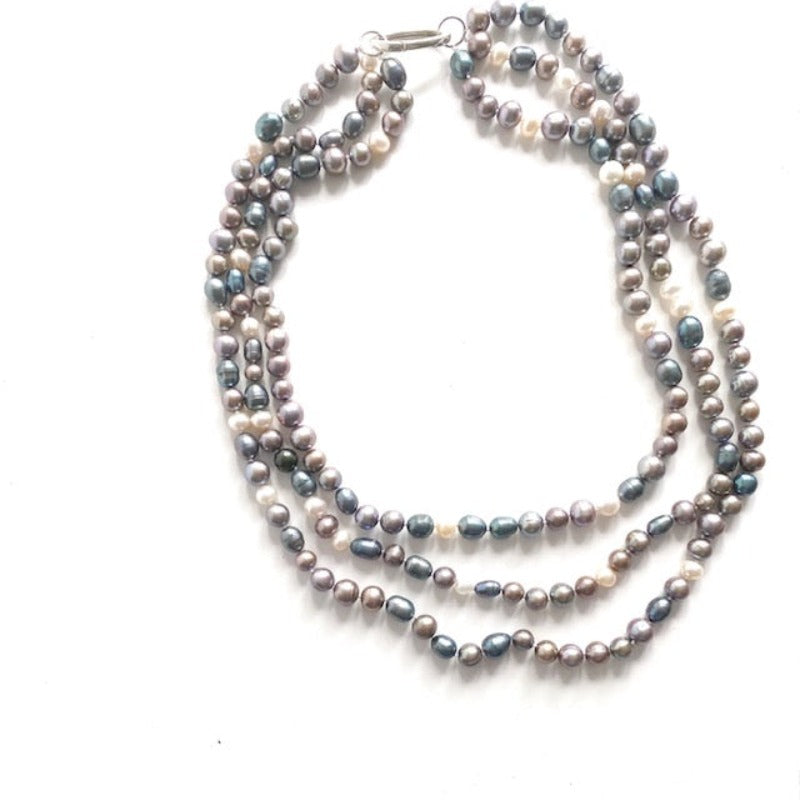 Triple strand lavender blue and white freshwater pearls 20-inch necklace with removable sterling oval link clasp top view