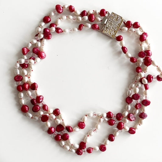 Three strand hand-knotted white and red pearl necklace 16-inch with fancy silver-plated filigree box clasp Top View